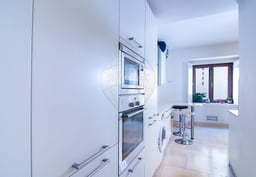 Modern furnished apartment with open kitchen and city view