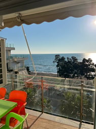 Seafront 1-Bed Apartment with Sea-View Balcony and Shared Pool Garden