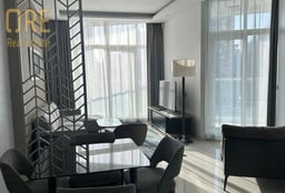 Furnished One-Bedroom City Apartment with Floor-to-Ceiling Windows